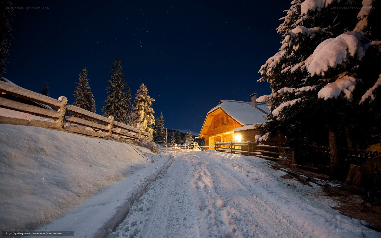 Snowy Cabin at Night