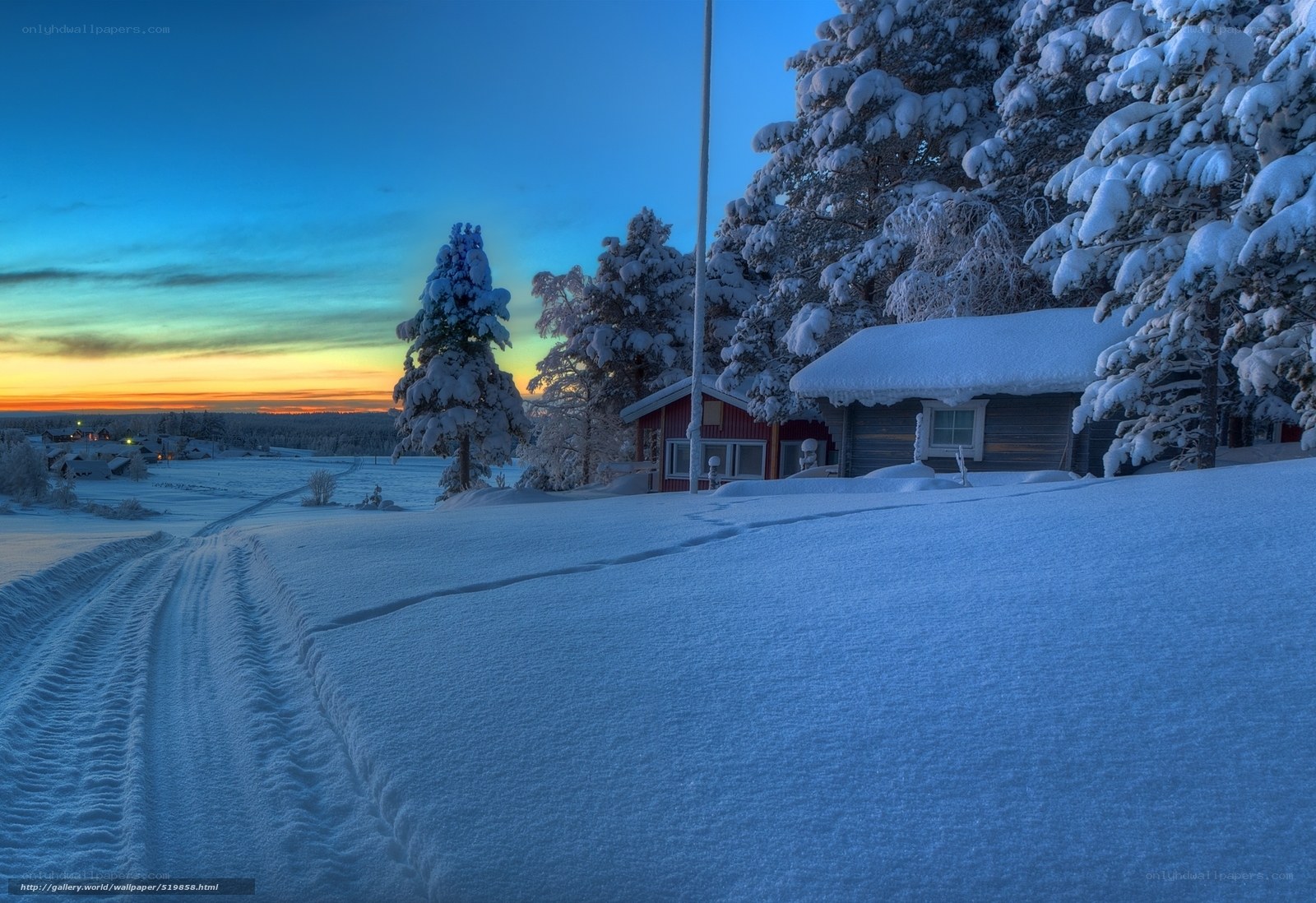 Snowy cabin at sunset