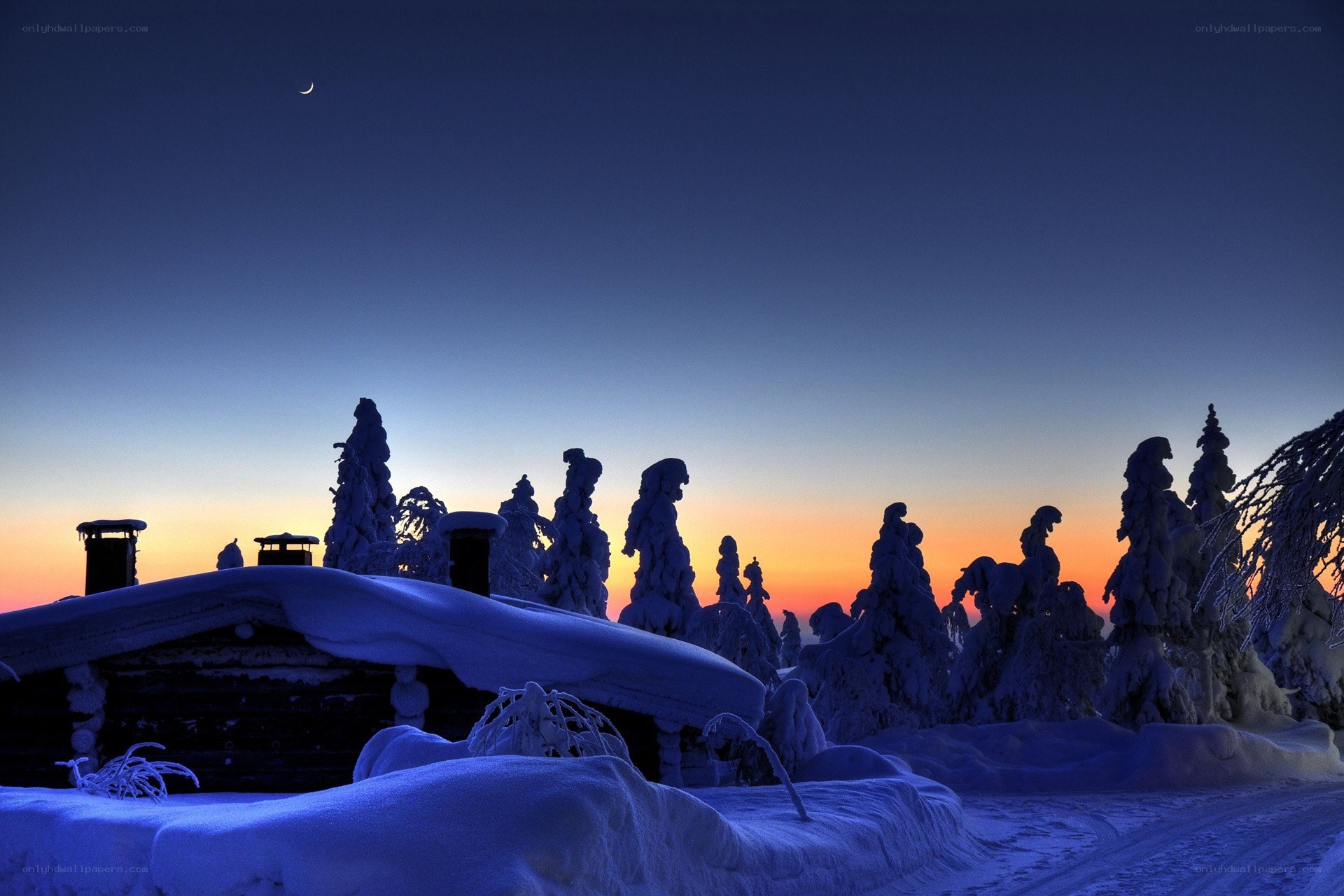 Snowy cabin at twilight