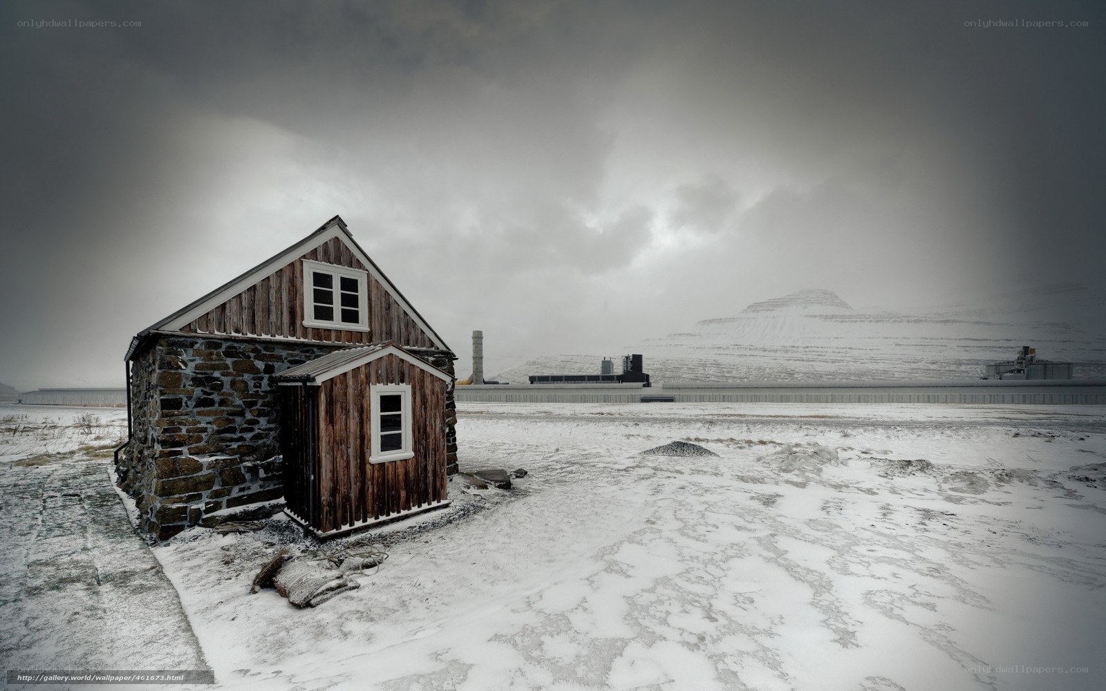 Snowy cabin in a desolate landscape