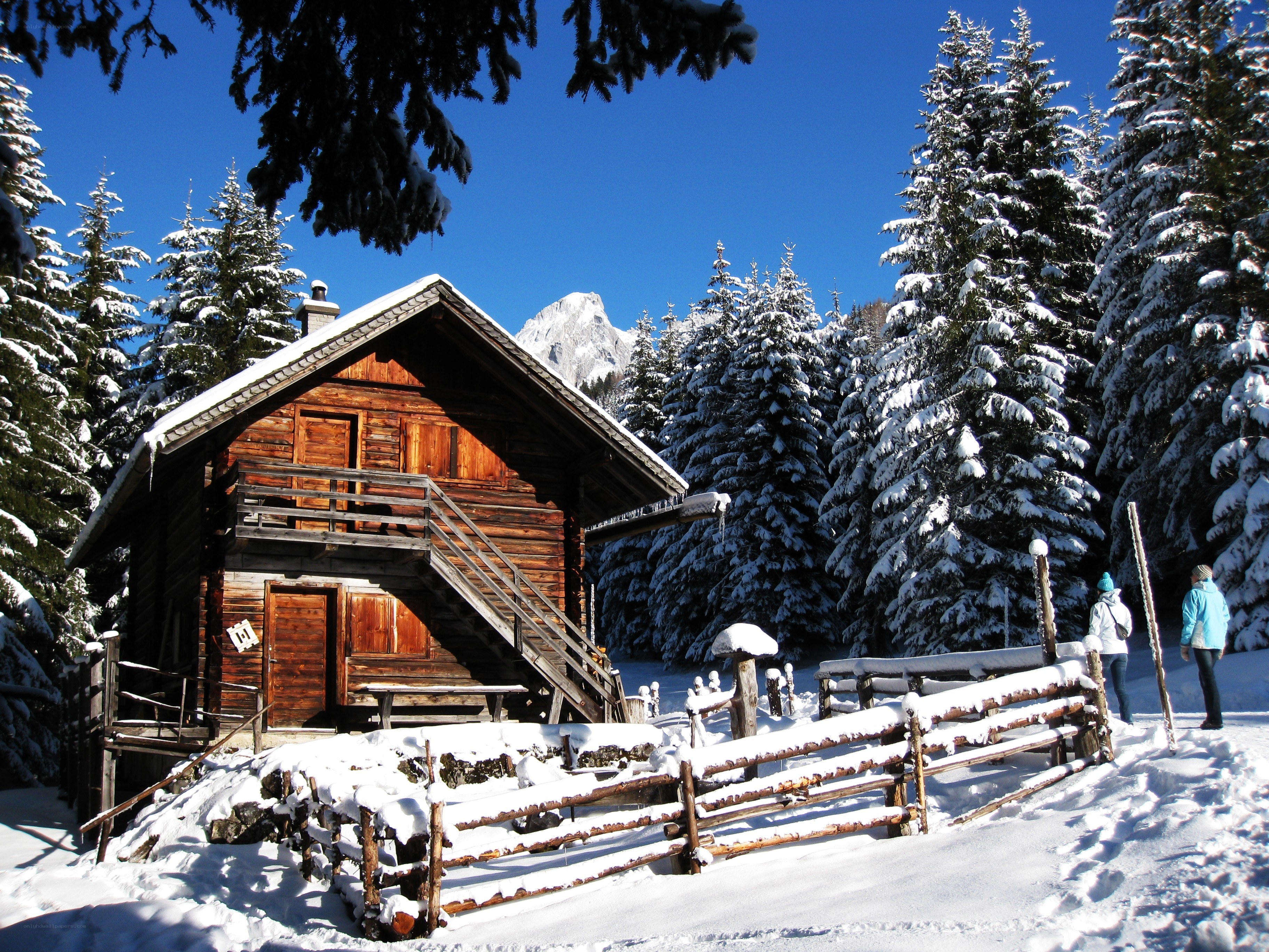 Snowy cabin in the mountains
