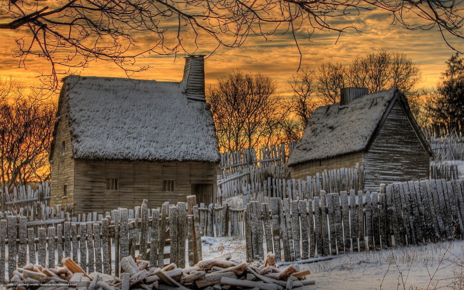 Snowy cabins at sunset
