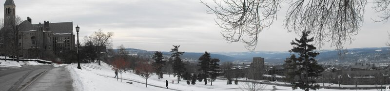 Snowy campus view with clock tower
