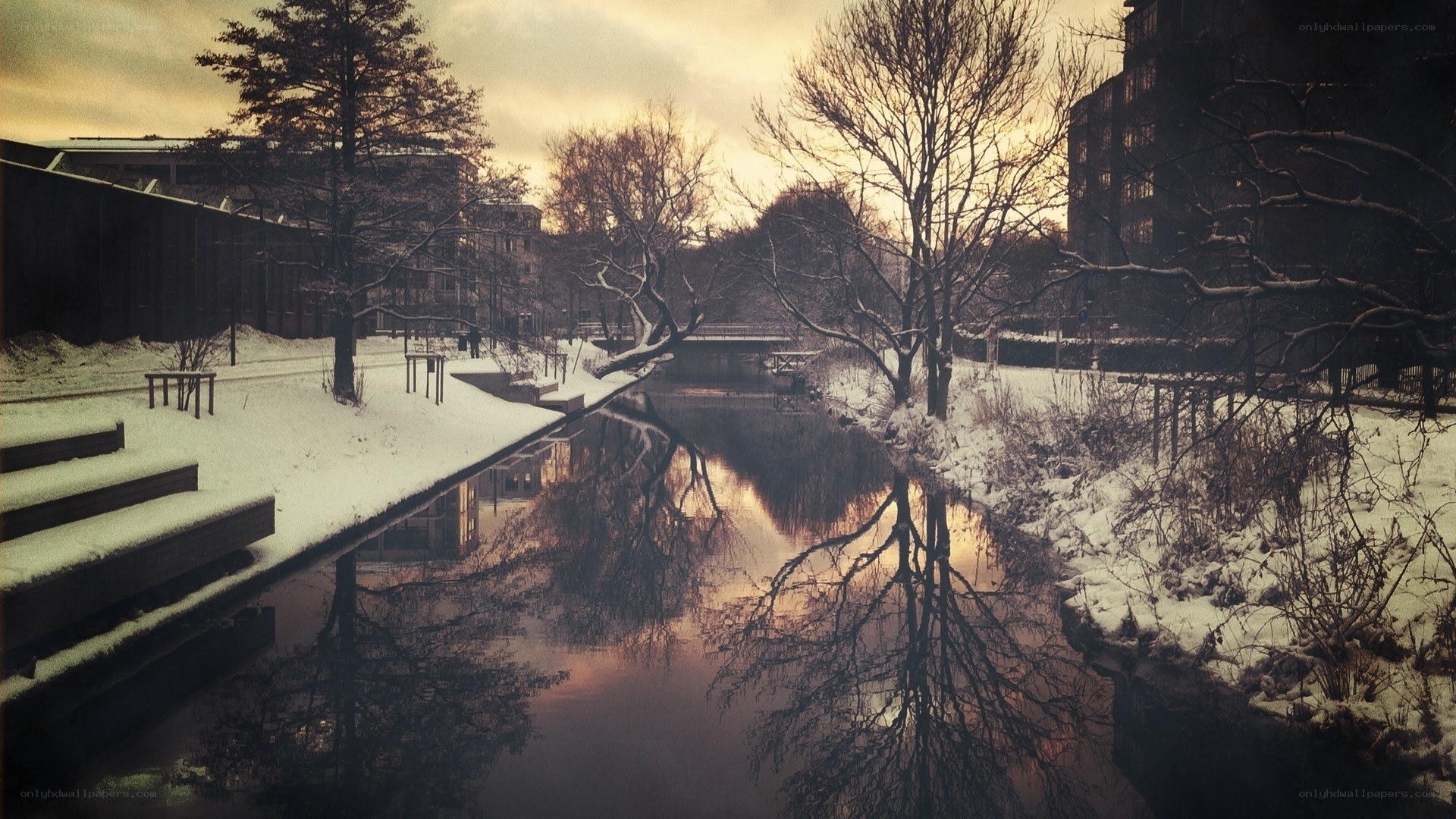 Snowy canal at dusk