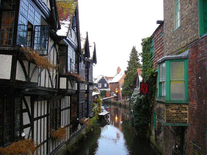 snowy canal in historic town