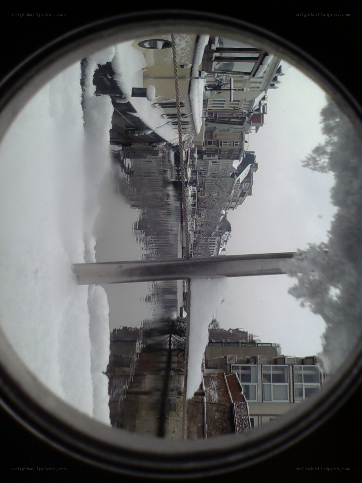 snowy canal view through porthole