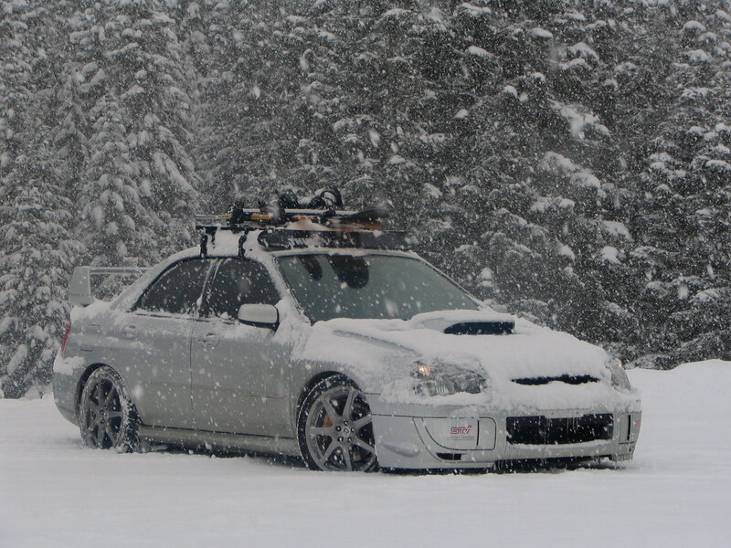 Snowy car with skis