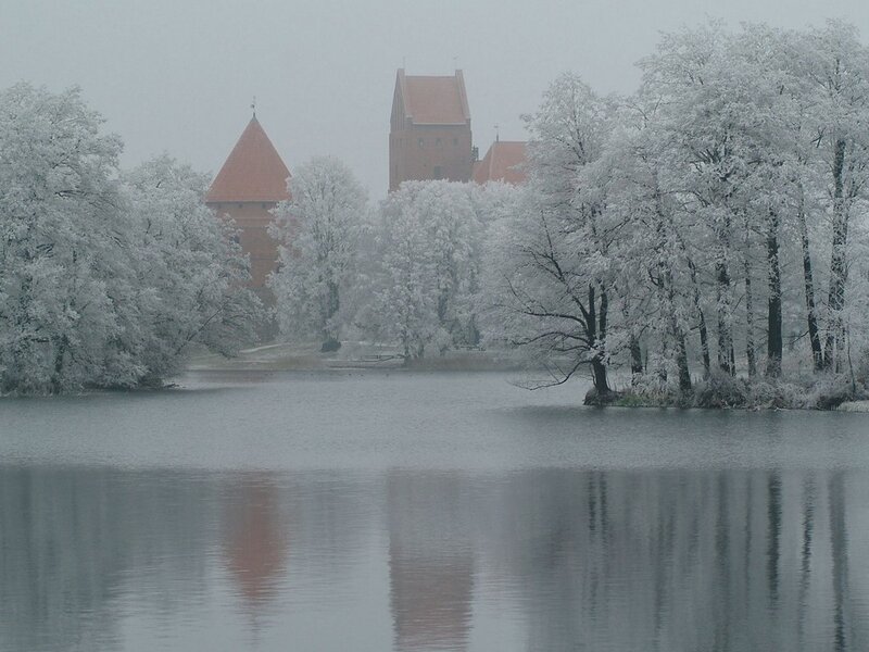 Snowy castle by a lake