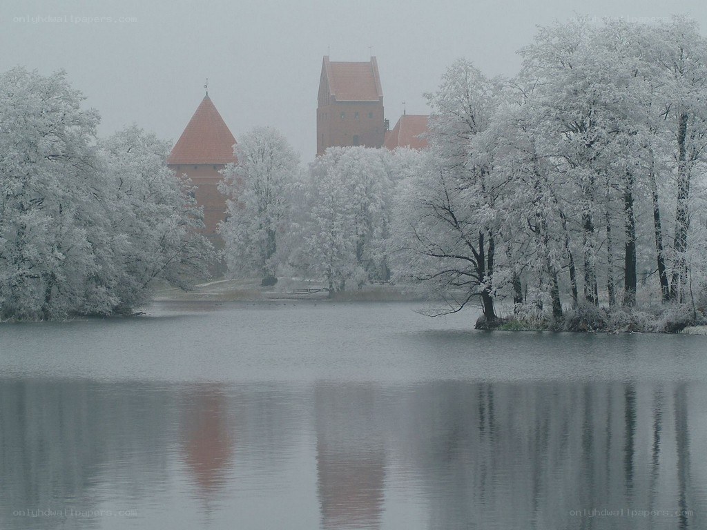 Snowy castle by a lake