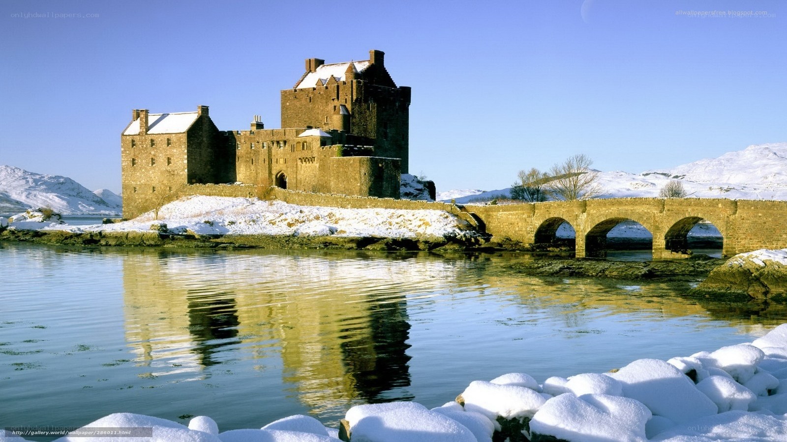 Snowy castle by a lake