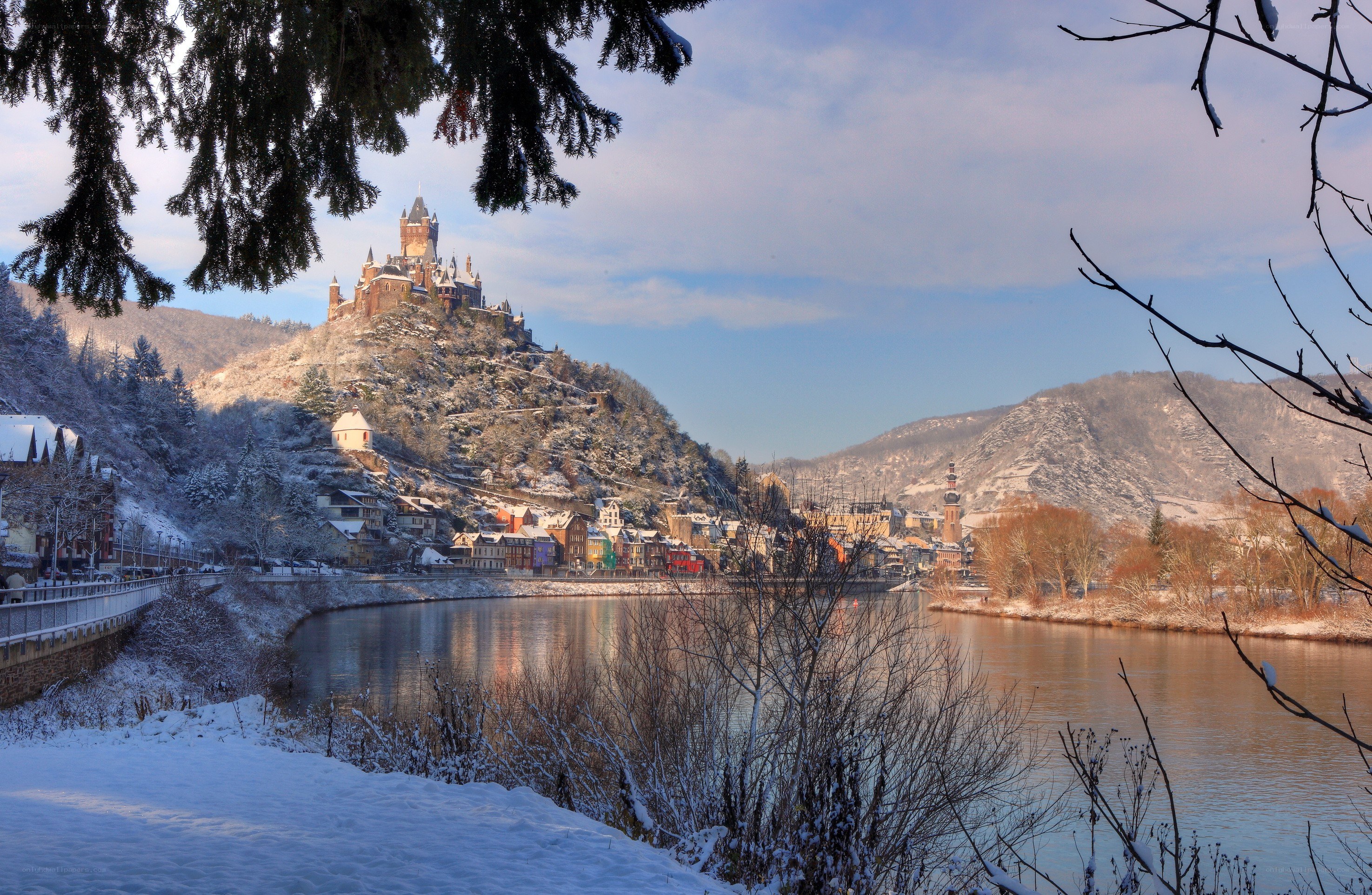 Snowy castle by the river