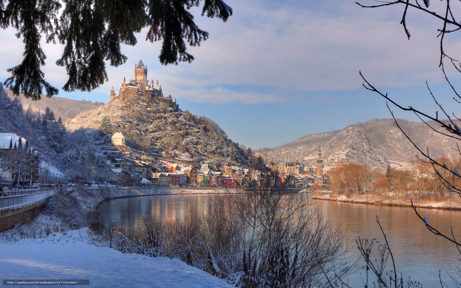 Snowy castle by the river