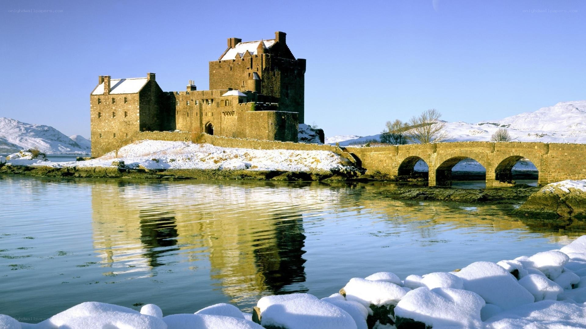 Snowy castle by the water