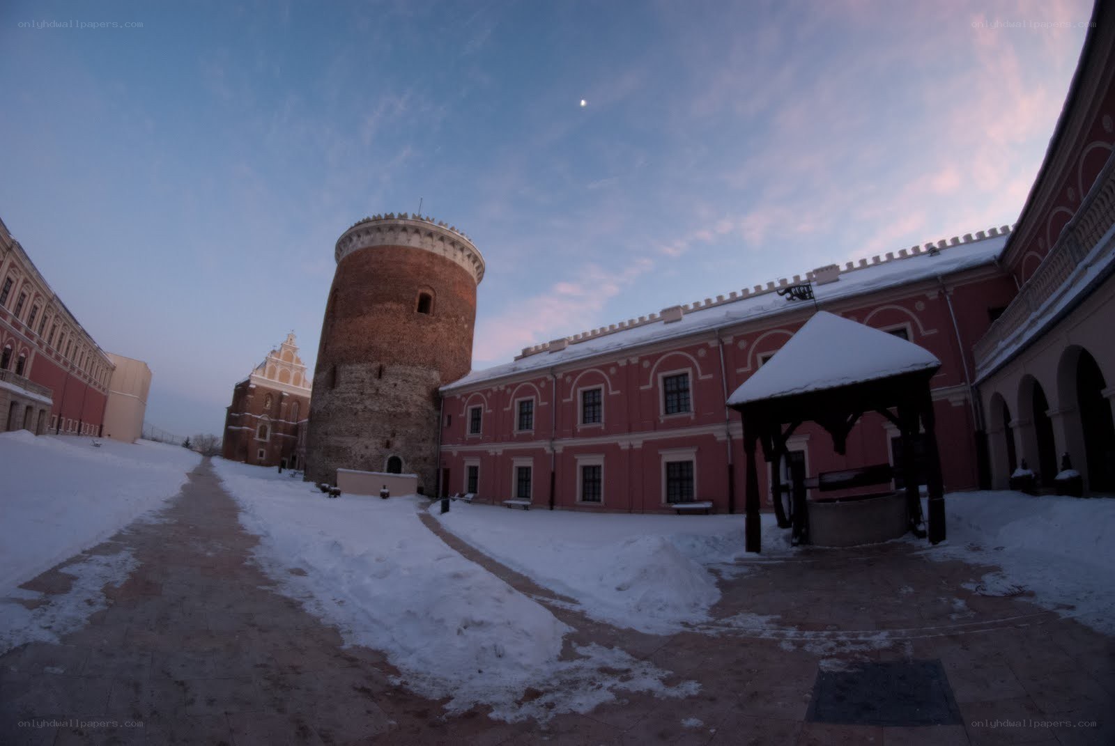 Snowy castle courtyard at dawn