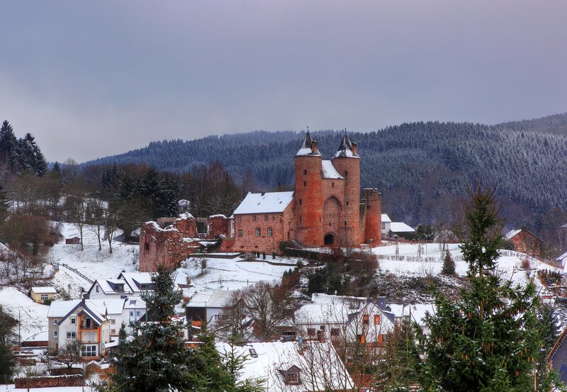 Snowy castle in a winter village
