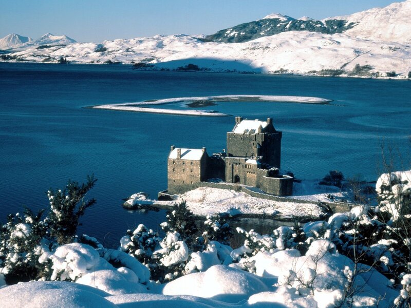 Snowy castle on a lake