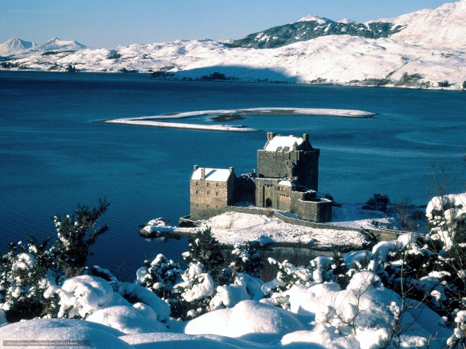 Snowy castle on a lake