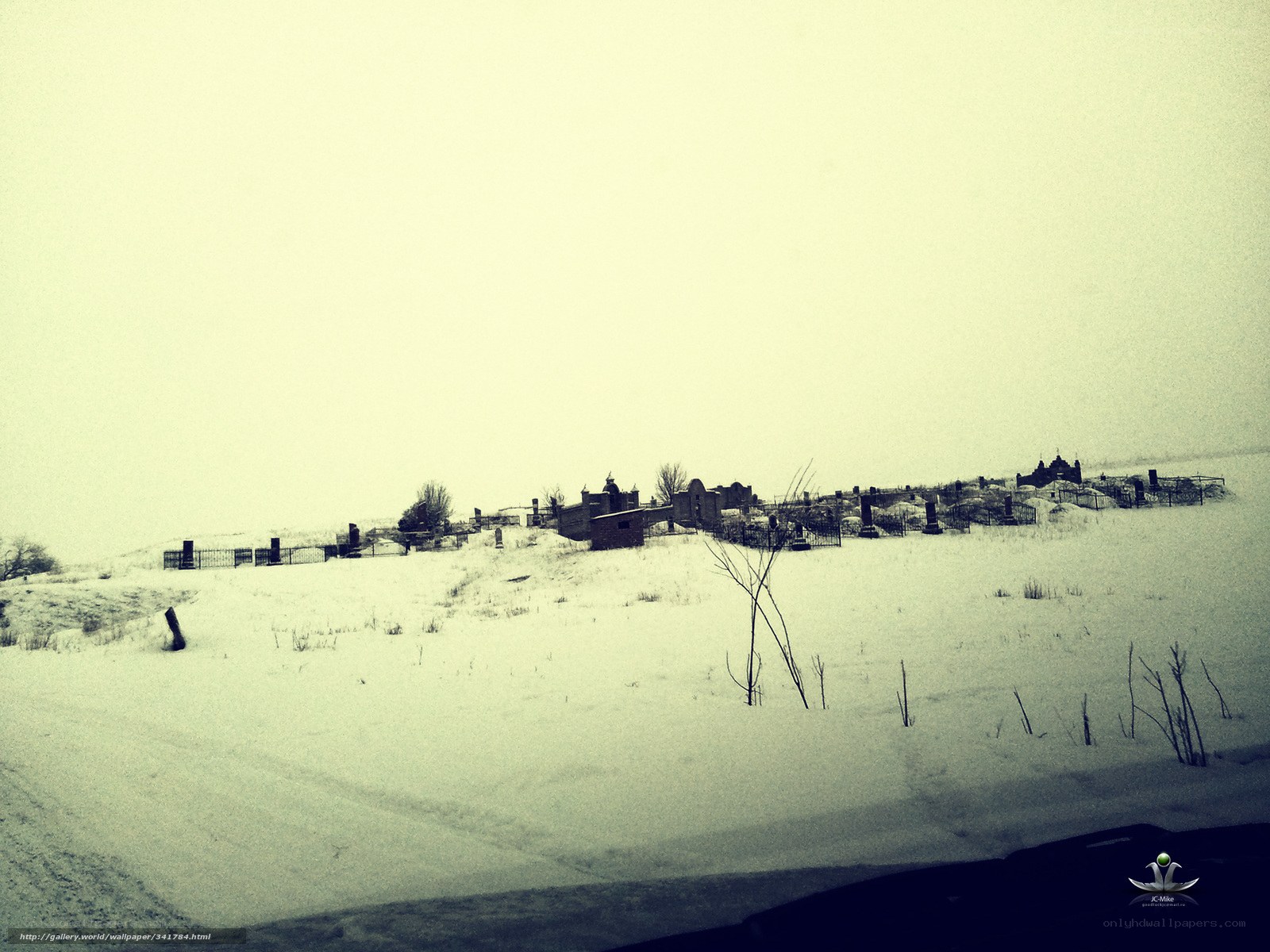 snowy cemetery on a hill