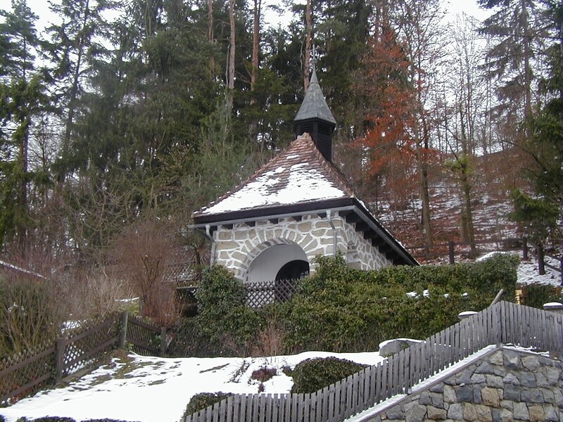 Snowy chapel in a forest