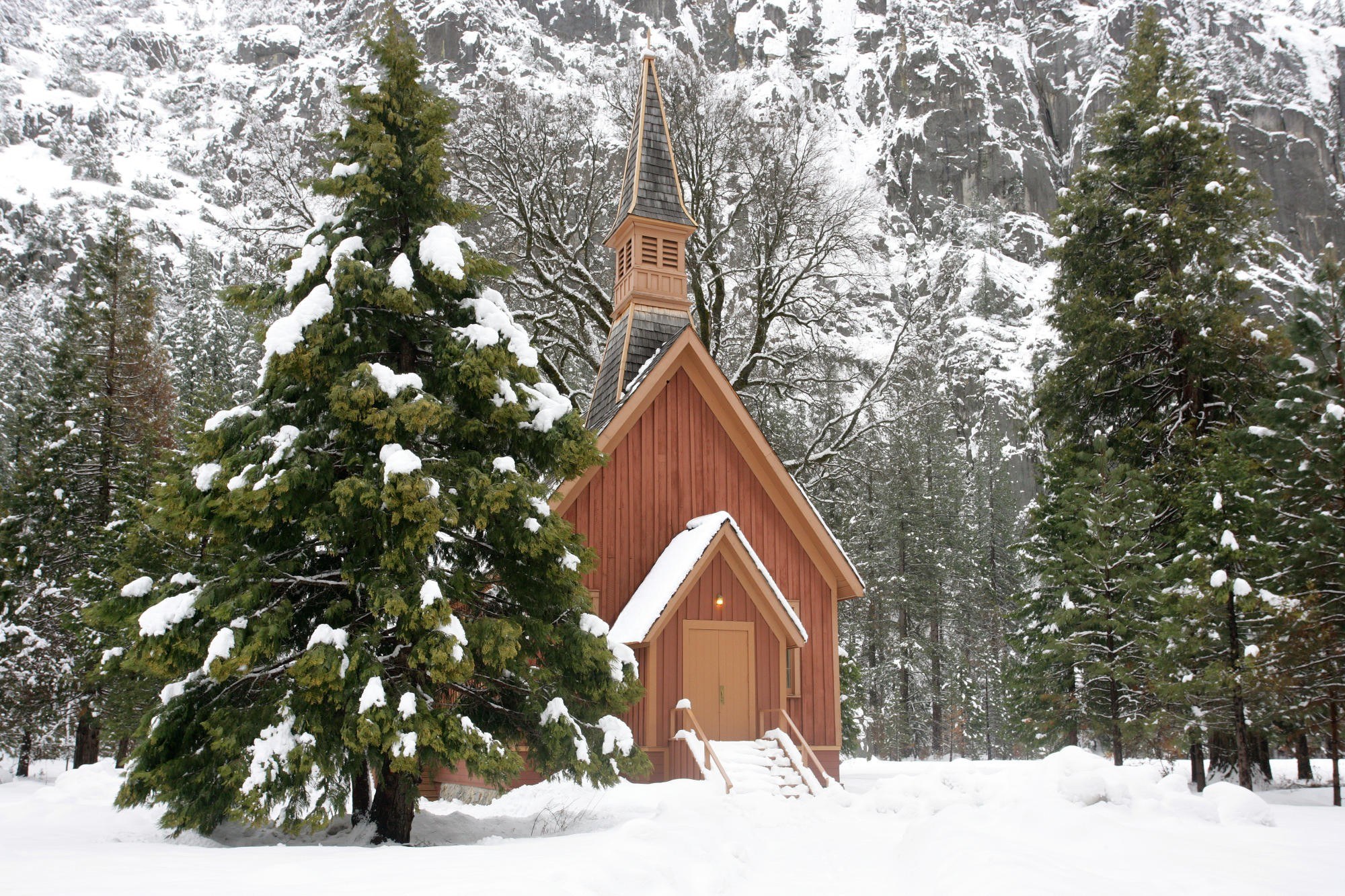 Snowy chapel in a forest