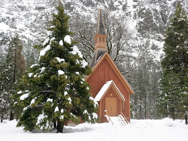 Snowy chapel in the mountains