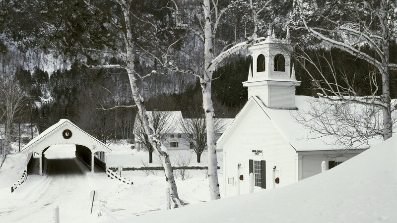 Snowy church and covered bridge