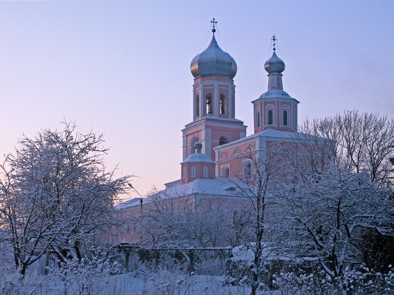 Snowy church at dawn