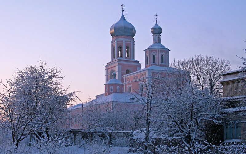 Snowy church at dawn