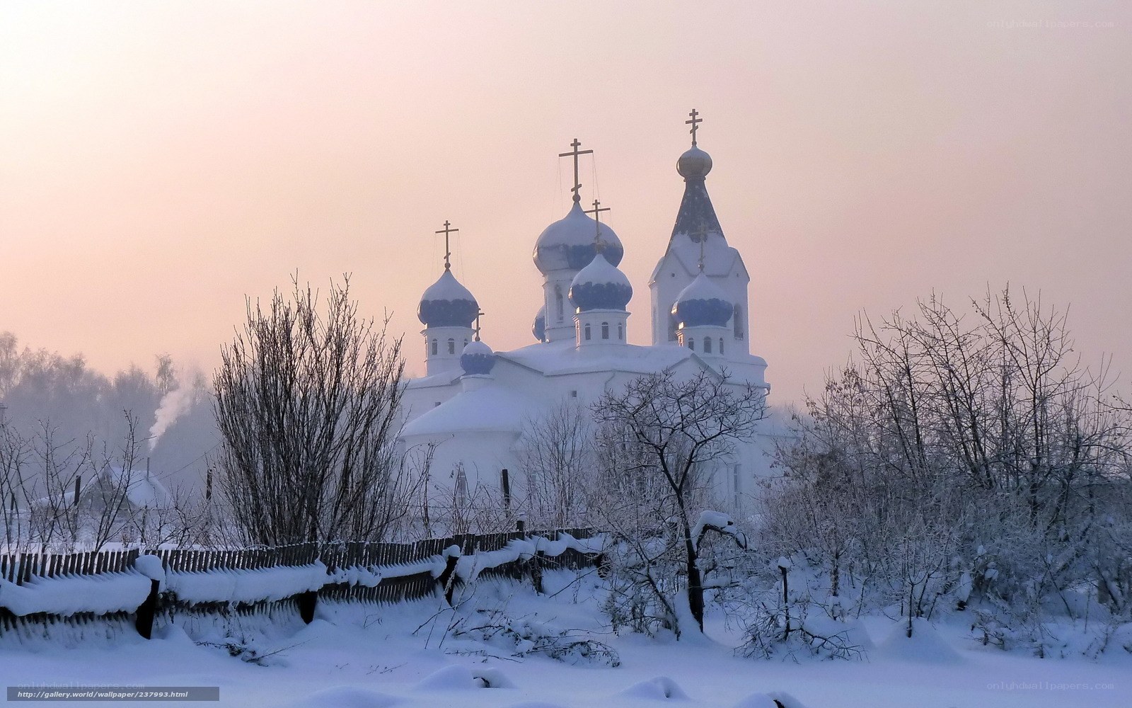 Snowy church at dawn