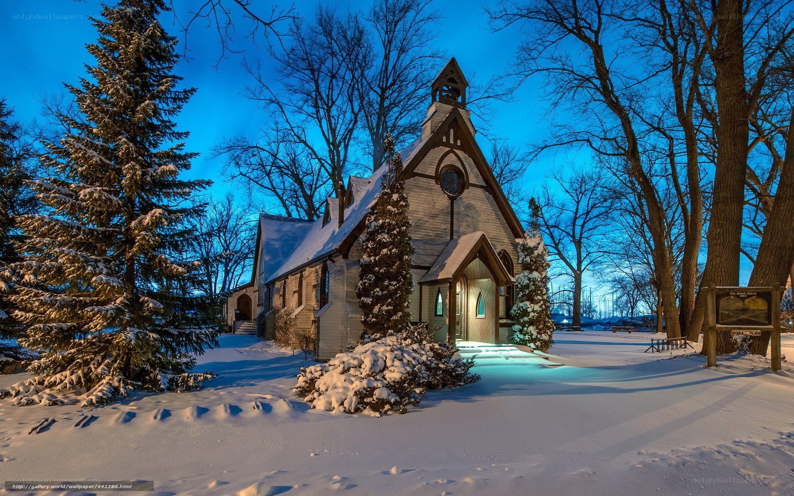 Snowy church at dusk