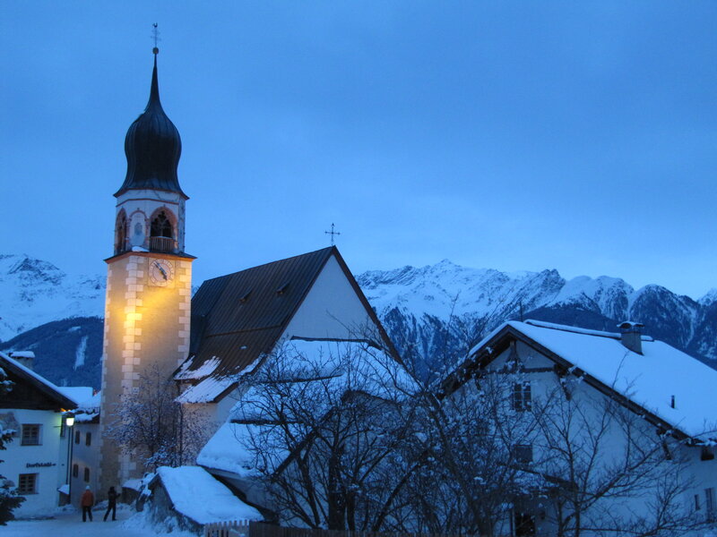 Snowy church at dusk