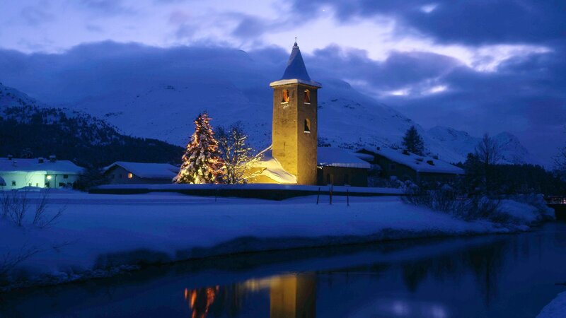 Snowy church at dusk