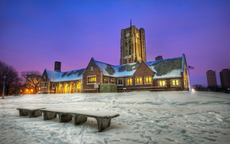 Snowy church at dusk