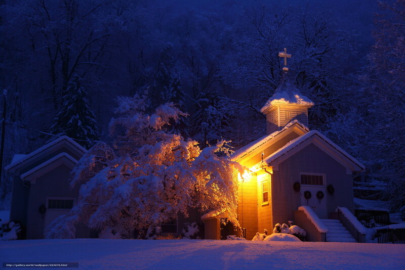 Snowy church at night