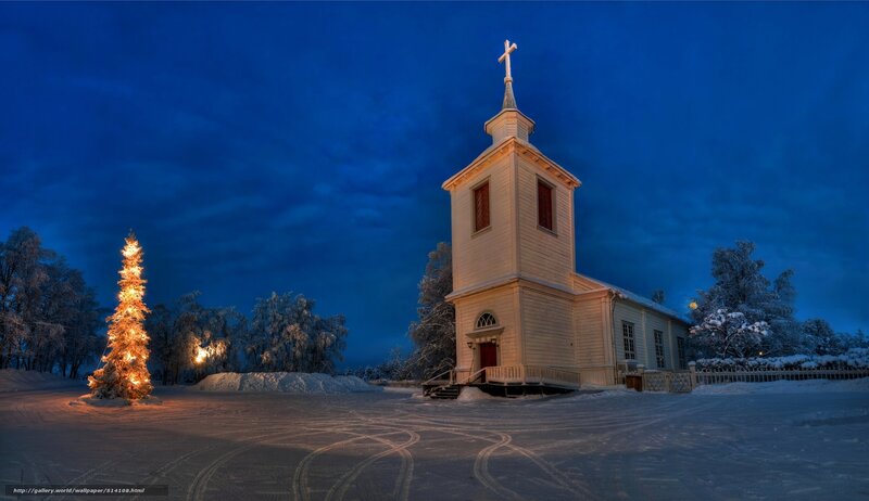 Snowy church at night
