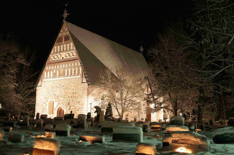 Snowy church at night