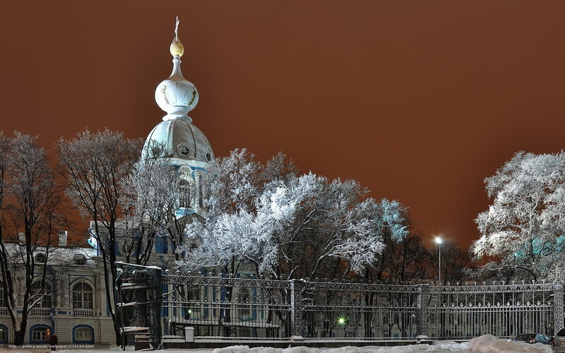 Snowy church at night