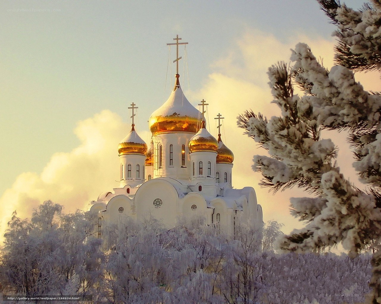 Snowy church at sunset