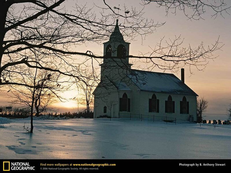 Snowy church at sunset