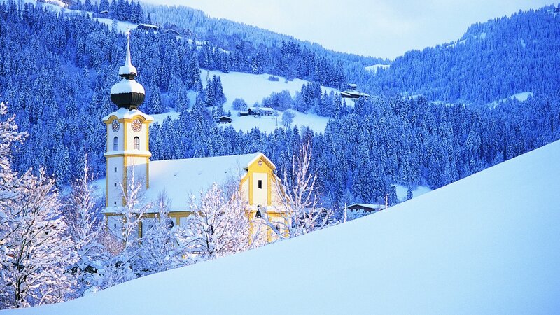 Snowy church in alpine village