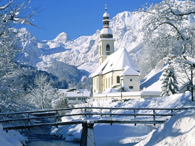 Snowy church in mountain valley