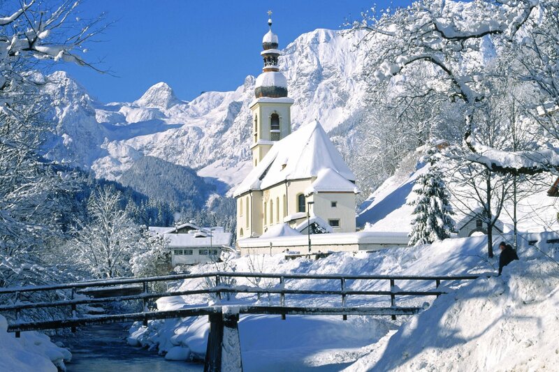 Snowy church in mountain valley