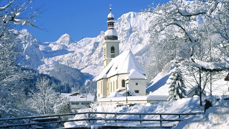 Snowy church in mountain valley