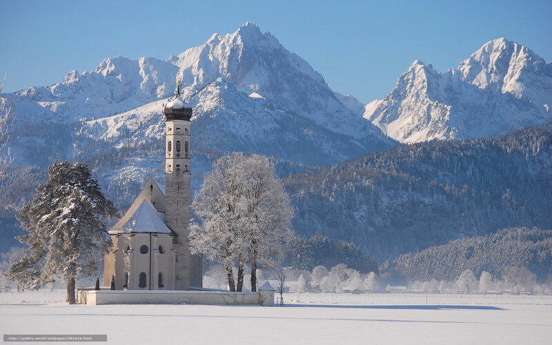 Snowy church in mountain valley