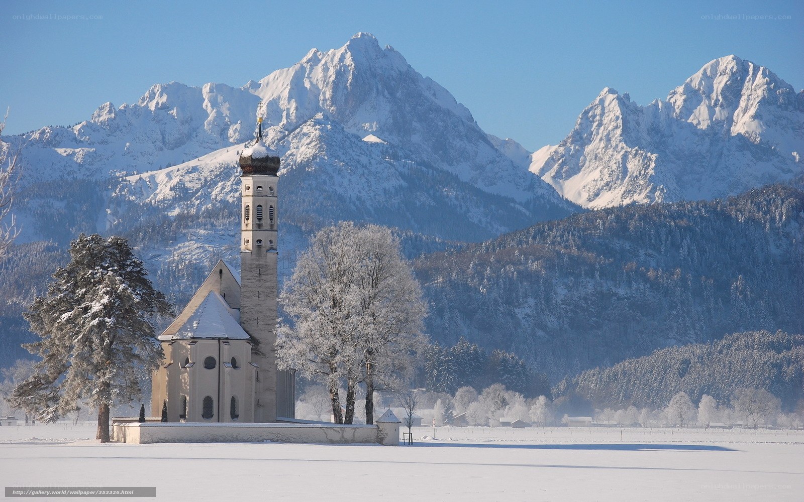 Snowy church in mountain valley