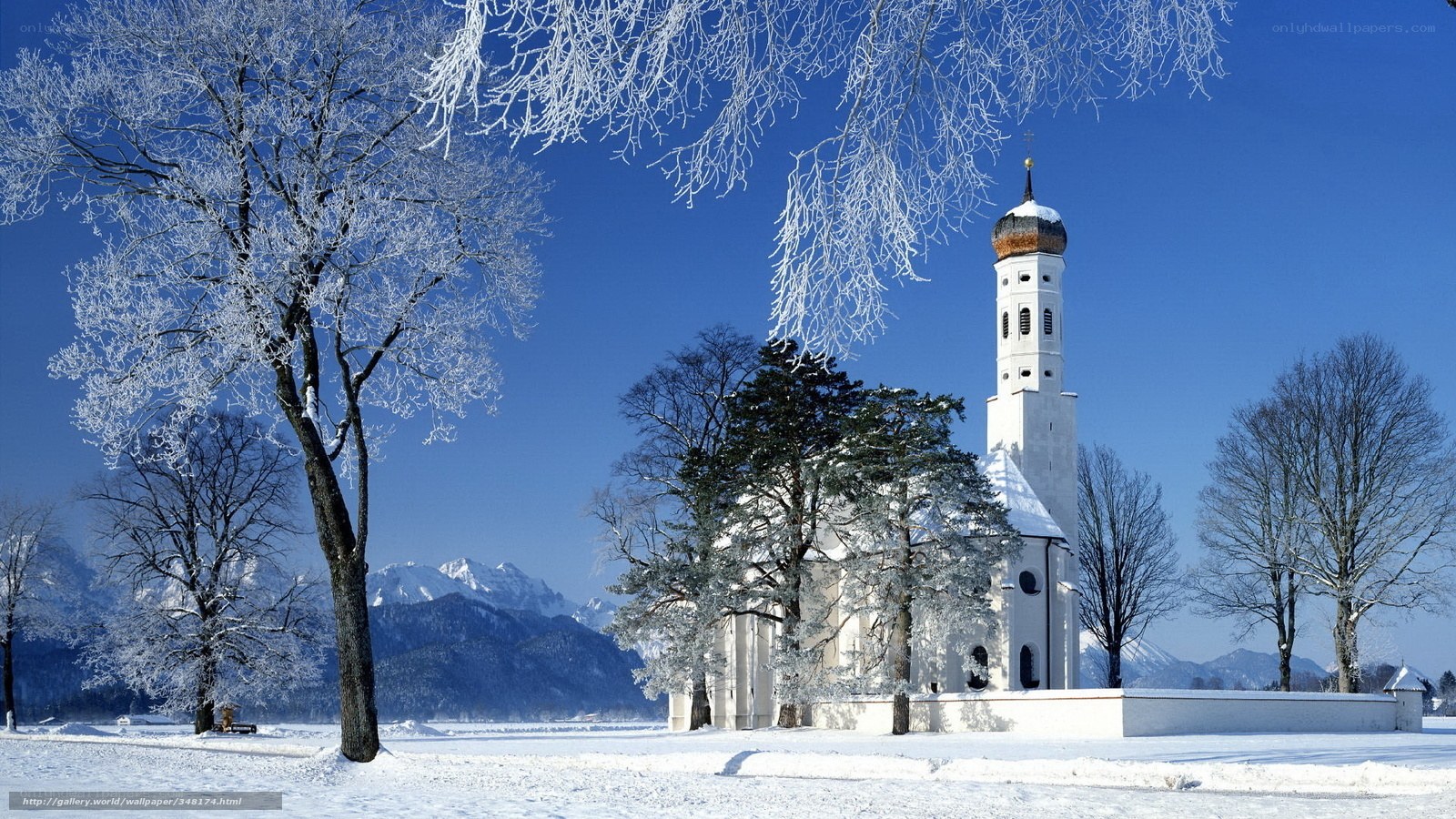 Snowy church in winter landscape