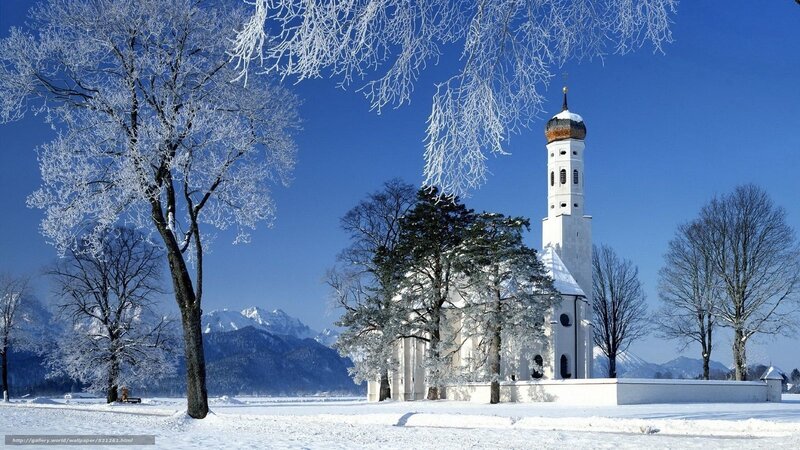 Snowy church in winter landscape