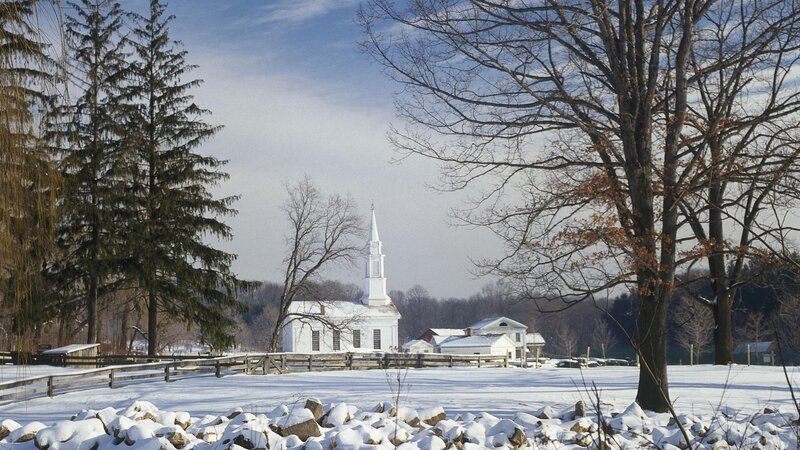 Snowy church in winter landscape