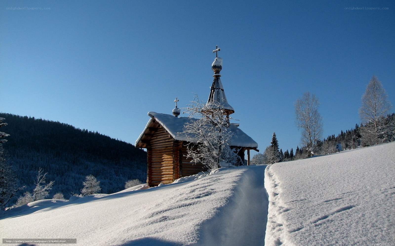 Snowy church in winter landscape