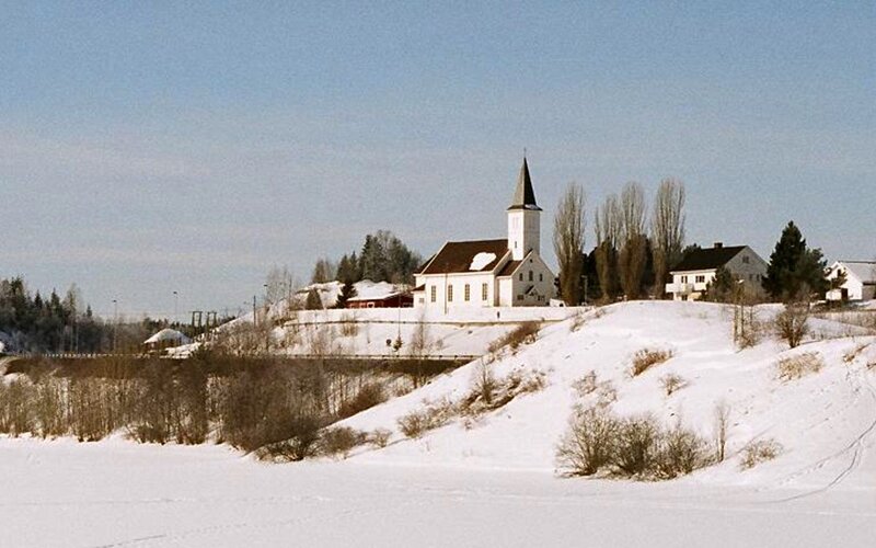 snowy church on a hill
